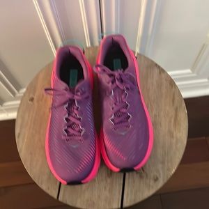 Bright pink and purple Hoka running shoes